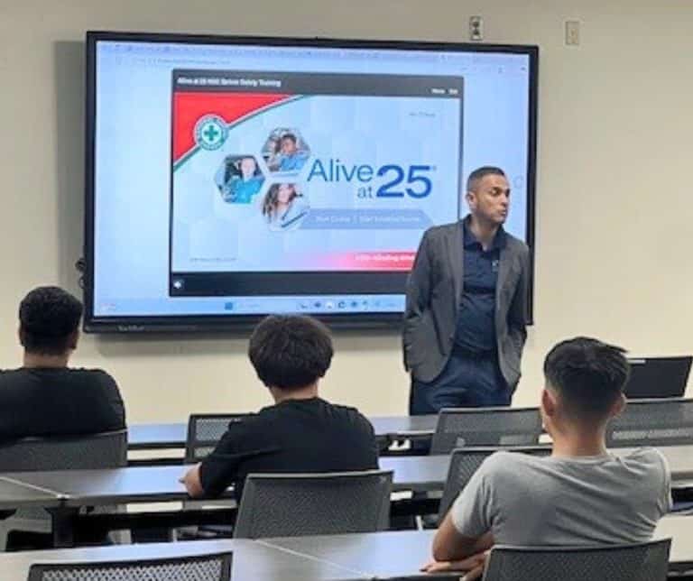 An Alive at 25 trainer speaking to students.