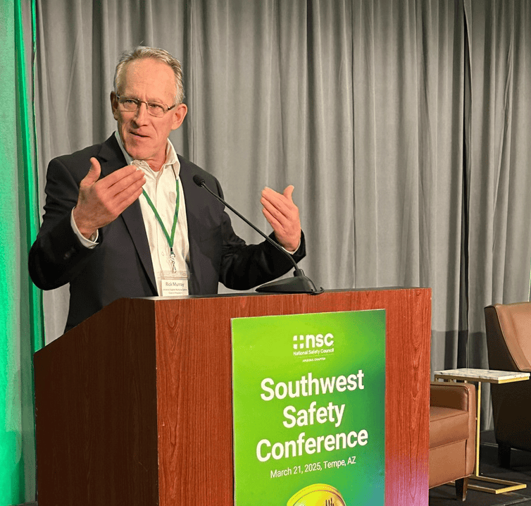 Rick Murray presenting at podium.