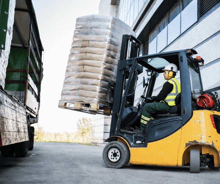 Driver operating forklift